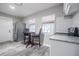 Modern kitchen with gray wood floors, stainless steel appliances, and plenty of natural light at 1507 Holly Rd, Lakeland, FL 33801