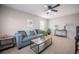 Cozy living room with comfortable seating, ceiling fan, and neutral decor at 1507 Holly Rd, Lakeland, FL 33801