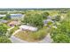 Aerial view of the property showcases its location within a neighborhood, near local amenities and roads at 1507 Neptune Dr, Lakeland, FL 33801
