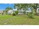 Spacious backyard with mature trees, offering ample space for outdoor activities and privacy at 1507 Neptune Dr, Lakeland, FL 33801
