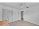 Clean bedroom with tile floors, closet and ceiling fan at 1507 Neptune Dr, Lakeland, FL 33801