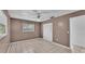 Bedroom with tile floors, closet, and a ceiling fan at 1507 Neptune Dr, Lakeland, FL 33801