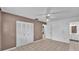 Bedroom with tile floors, a closet, and a door to an attached bathroom at 1507 Neptune Dr, Lakeland, FL 33801