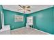Cozy bedroom with jade walls, ceiling fan, and furniture at 1507 Neptune Dr, Lakeland, FL 33801