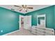 Bedroom with jade walls, a ceiling fan, closet and furniture at 1507 Neptune Dr, Lakeland, FL 33801