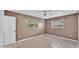 Bedroom with tile floors and natural light from two windows at 1507 Neptune Dr, Lakeland, FL 33801