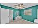 Bedroom with jade walls, a ceiling fan, closet and furniture at 1507 Neptune Dr, Lakeland, FL 33801