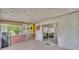 Enclosed patio leads into the dining area through sliding glass doors, offering seamless indoor-outdoor living at 1507 Neptune Dr, Lakeland, FL 33801