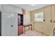 Room with tiled floor and small window at 1507 Neptune Dr, Lakeland, FL 33801