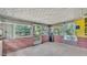 Enclosed sunroom with brick base and tiled floors at 1507 Neptune Dr, Lakeland, FL 33801
