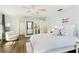Relaxing bedroom with an accent chair, walk in closet and white furniture at 1516 Jae Pl, Lakeland, FL 33803
