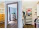 Organized walk-in closet with ample storage, custom shelving and rods to maximize space for clothes and accessories at 1516 Jae Pl, Lakeland, FL 33803