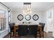 Elegant dining room featuring a modern chandelier and stylish decor at 1516 Jae Pl, Lakeland, FL 33803