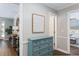 Hallway showcasing decorative furniture, wall art, and doorways leading to other rooms at 1516 Jae Pl, Lakeland, FL 33803