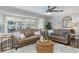 Comfortable living room featuring hardwood floors, two sofas, and a decorative rug at 1516 Jae Pl, Lakeland, FL 33803