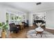 Bright living room with a bay window, hardwood floors, and stylish decor at 1516 Jae Pl, Lakeland, FL 33803