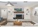 Cozy living room featuring a brick fireplace, built-in shelving, and stylish décor at 1516 Jae Pl, Lakeland, FL 33803