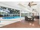Inviting outdoor pool area with a screened-in patio, plenty of seating, and a large pool for relaxation at 1516 Jae Pl, Lakeland, FL 33803