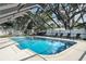Beautiful screened pool with ample deck space, perfect for sunbathing and outdoor relaxation in a private setting at 1516 Jae Pl, Lakeland, FL 33803