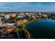 Aerial view of a brick building on a lake in the middle of a city at 200 Lake Morton Dr # 100, Lakeland, FL 33801