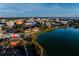 Aerial view of a brick building on a lake in the middle of a city at 200 Lake Morton Dr # 100, Lakeland, FL 33801