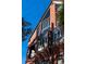 Close-up of the brick building showcasing large windows and unique architectural details against a clear blue sky at 200 Lake Morton Dr # 100, Lakeland, FL 33801
