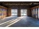 Spacious interior highlighted by light-filled windows and exposed framing for future construction at 200 Lake Morton Dr # 100, Lakeland, FL 33801