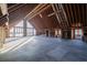 Spacious unfinished room with large windows and exposed beams, perfect for customization and natural light at 200 Lake Morton Dr # 100, Lakeland, FL 33801