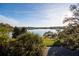 Scenic water view overlooking the serene lake, lush greenery, and a clear blue sky at 200 Lake Morton Dr # 100, Lakeland, FL 33801