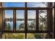 Picturesque lake view from a window showing the water and lush foliage at 200 Lake Morton Dr # 100, Lakeland, FL 33801