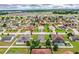 Spacious residential area with manicured lawns, tree-lined streets, and diverse housing options at 2040 Chickadee St, Bartow, FL 33830