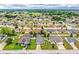 An extensive view of a neighborhood filled with green spaces, diverse home designs, and community charm at 2040 Chickadee St, Bartow, FL 33830