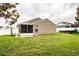 Exterior of home showcasing screened patio, boat, and well maintained lawn at 2040 Chickadee St, Bartow, FL 33830