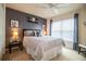 Comfortable bedroom featuring a modern color scheme, a ceiling fan, and soft, natural light at 2040 Chickadee St, Bartow, FL 33830