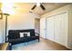 Bedroom with a futon, ceiling fan, and a double door closet for storage at 2040 Chickadee St, Bartow, FL 33830