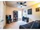 This bedroom features a TV, desk, bookshelf, and a futon for flexible use at 2040 Chickadee St, Bartow, FL 33830