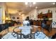 Eat-in kitchen and dining area with glass table and view to living room at 2040 Chickadee St, Bartow, FL 33830
