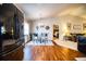 Dining area with glass table, adjacent to an open kitchen and view of a bedroom at 2040 Chickadee St, Bartow, FL 33830