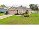 Charming single-Gathering home featuring well-maintained landscaping and a two-car garage at 2040 Chickadee St, Bartow, FL 33830