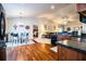 Open-concept space featuring a dining area, kitchen with black appliances, and a living room at 2040 Chickadee St, Bartow, FL 33830