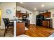 Spacious kitchen with breakfast bar, wooden cabinets, and black refrigerator at 2040 Chickadee St, Bartow, FL 33830