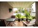 Covered lanai featuring patio furniture, providing a comfortable and relaxing outdoor living space at 2040 Chickadee St, Bartow, FL 33830
