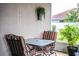 Inviting covered lanai featuring comfortable seating, an outdoor dining area, and views of the backyard at 2040 Chickadee St, Bartow, FL 33830