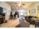 Comfortable living room featuring cozy furniture, an electric fireplace, and an open floor plan at 2040 Chickadee St, Bartow, FL 33830