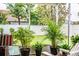 Enclosed porch featuring potted tropical plants offering a relaxing indoor/outdoor living space at 2040 Chickadee St, Bartow, FL 33830