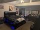 A large main bedroom boasts a modern bed frame with an upholstered headboard at 208 Center St, Auburndale, FL 33823