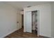 Bedroom showcasing an open closet and white doors, offering ample storage space at 2219 New Jersey Rd, Lakeland, FL 33803