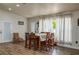 Dining room features a large table and chairs, with lots of natural light at 2219 New Jersey Rd, Lakeland, FL 33803