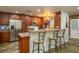 Updated kitchen features granite countertops, stainless steel appliances, and a breakfast bar with seating at 2219 New Jersey Rd, Lakeland, FL 33803