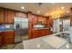 Kitchen featuring stainless steel appliances, wooden cabinets, and expansive countertops at 2219 New Jersey Rd, Lakeland, FL 33803